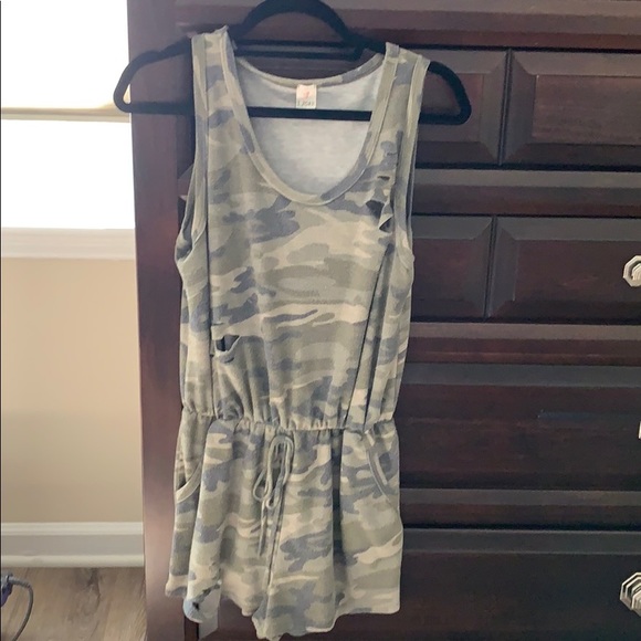 Pants - Women’s camo romper with cut holes.